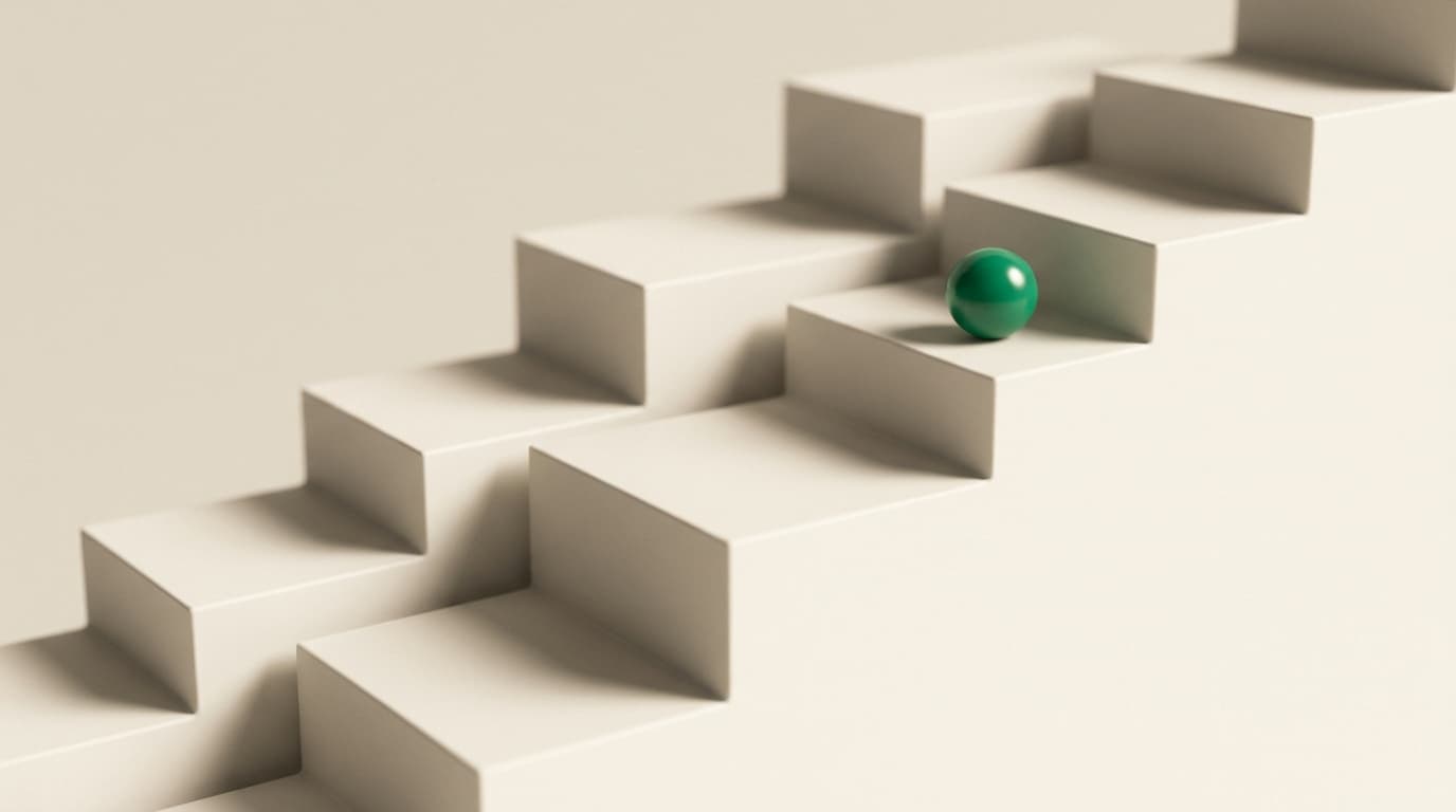 A green sphere resting partway up an ascending staircase of steps